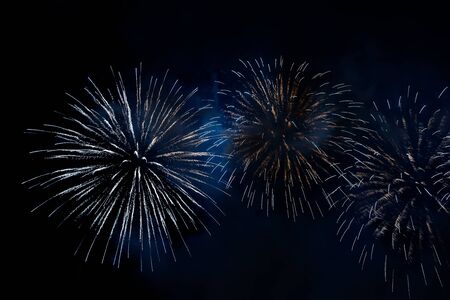 Colorful firework with bokeh background with copy space for New Year celebration, Abstract holiday...