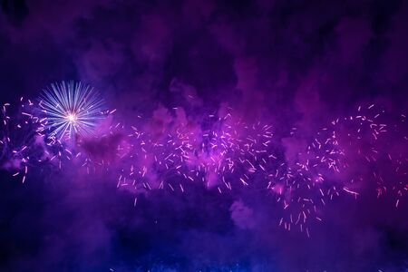 Colorful firework with bokeh background with copy space for New Year celebration, Abstract holiday backgroundの写真素材