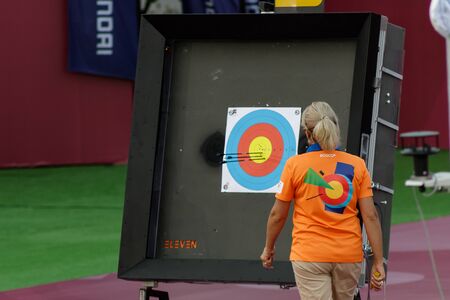 Moscow, Russia, September 07, 2019. MOSCOW HYUNDAI ARCHERY WORLD CUP, men from different countries compete in archery. Checking the results of shots at targetsのeditorial素材