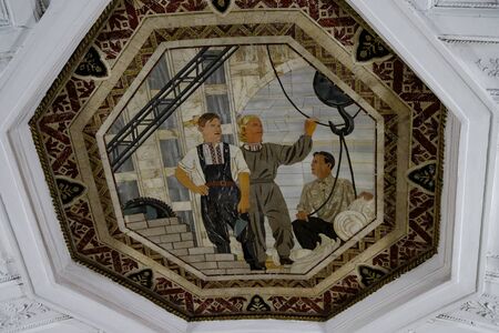 Moscow, Russia 10.13. 2019 Belorusskaya metro station near Belorussky railway station. The mosaic panel on the ceiling of the lobby reflects the life of the Belarusian people in the Soviet era and is made in the technique of Florentine mosaicのeditorial素材