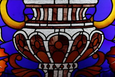 Detail of a stained glass window, bright colors, shot close-up.の写真素材