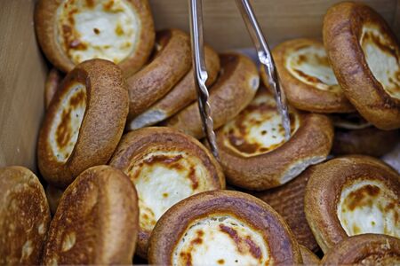 The soft toasted buns are in a box at the grocery store. Quick Breakfast-bun with coffee. Popular food.の写真素材