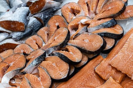 Different types of fresh fish on ice in supermarket, top view. Close up fresh fish on ice bucket or frozen fish in grocery store use for raw food backgroundの写真素材