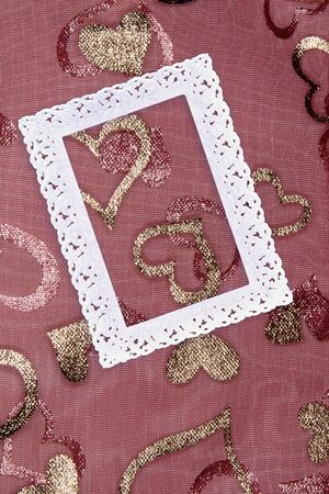 White openwork frame on a pink background with gold hearts. Love heart frame. Happy mother's day...