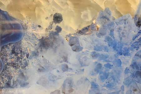 closeup beautiful polished stone with interesting details in texture and natural colors yellow with...