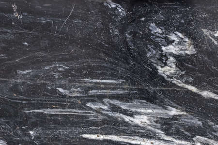 dark gray marble texture with scratches. Natural patterned stone for background, copy space and design. Abstract marble stone surface. Gray color, backdropの写真素材