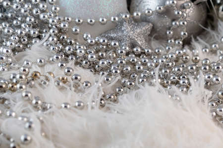 Poster with silver Christmas balls. Beautiful Christmas composition with copy space on a fluffy white fur background.の写真素材