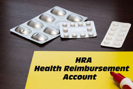 Health Reimbursement Account HRA, the text is written on a yellow sheet. The concept of medical care...