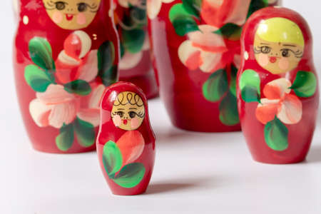 Russian folk wooden toy matryoshka, isolate on a white background. Folk traditions and culture.の写真素材