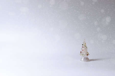 Poster with a toy tree, empty space background for text. Light colors, minimalism conceptの写真素材