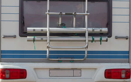 Caravan trailer, mobile home for family travel, close-up. Camping concept, hyper-local travel,...