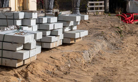 Small construction site. Cement blocks lie on the ground, ready for laying. Landscaping, small-scale constructionの写真素材