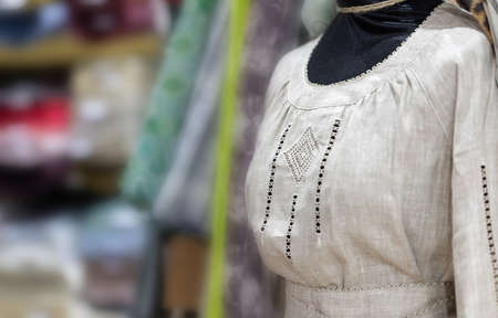 Blurred background of a small shop interior with natural fabrics.の写真素材