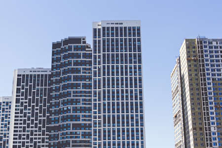 Modern high-rise apartment buildings. Housing for urban families in a residential area. Geometric...