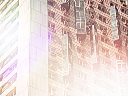 Detail of a modern high-rise apartment building. Typical city development. Multi-storey residential...