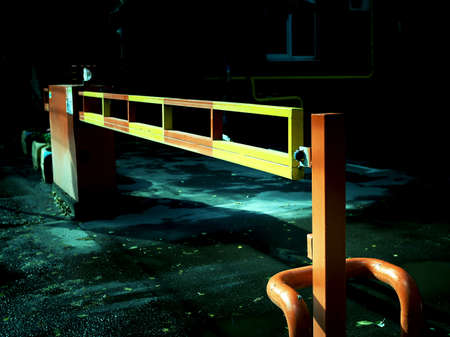 Automatic gate barrier. Tinted image of a closed barrierの写真素材