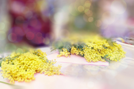 Sale of flowers for the spring holidays. Bright yellow mimosa bouquets. flower's business. Lifestyle flower shop. Copy space for design, selective focus.の写真素材