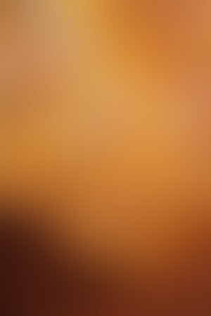 Soft gradient color background in autumn colors. Gradient yellow orange background. Gradient golden light. Abstract background in golden colors for your design. Elegant template for your design.の写真素材
