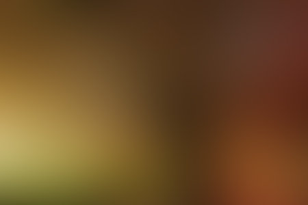 Soft gradient color background in autumn colors. Gradient yellow orange background. Gradient golden light. Abstract background in golden colors for your design. Elegant template for your design.の写真素材