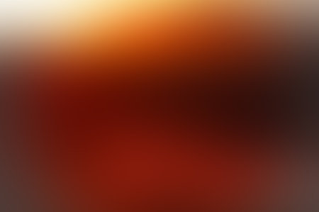 Soft gradient color background in autumn colors. Gradient yellow orange background. Gradient golden light. Abstract background in golden colors for your design. Elegant template for your design.の写真素材