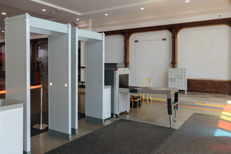 X-ray scanner and metal detector at security point. Security gates with metal detectors and scanners...