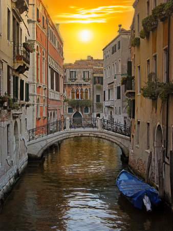 Channel in Venice. Romantic view of a Venetian channel on sunset. Sunset colors in Venice, Italy.の写真素材