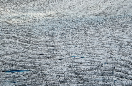 Over the Greenland Ice Sheet. Aerial view of the endless ice sheet to horizon. Concept of coldness and isolationの写真素材