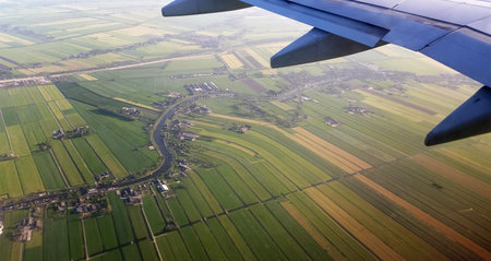 View from the plane to the spring fields. Aerial view on the agricultural fields in the landscape of the Netherlandsの写真素材