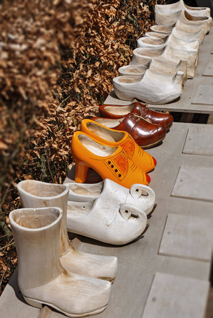 Dutch clogs on sale at the flower market in Amsterdam, Netherlands. Row traditional Dutch wooden shoes - klompenの写真素材