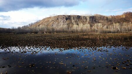 The mountain is surrounded by a beautiful lake. Do not often see thisの写真素材