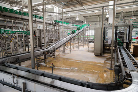 A conveyer belt with packs for beer is seen during production process in the Molson Coors Kamenitza beer brewery, April 28, 2015, near the city of Haskovo, Bulgaria.のeditorial素材