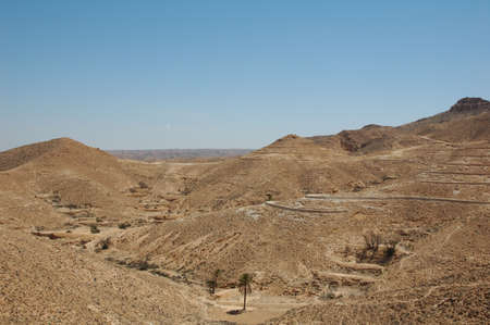 Moon landscape in the sand dunes of Tunisia in the Sahara Desert near the village of Matmata. where Star wars and English patient were shotの写真素材
