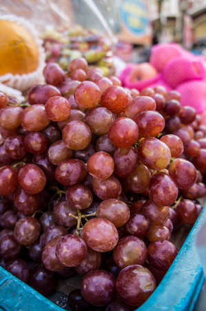 grape seller on the marketの写真素材