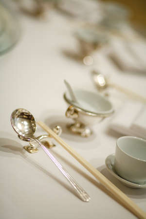 silverware spoon chopsticks on the tableの写真素材