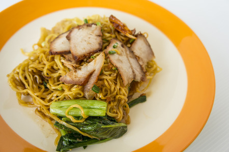 noodle food plate orange vegetable pork red lunchの写真素材