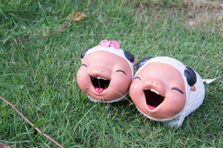 sheep ceramic doll garden grass two youngの写真素材