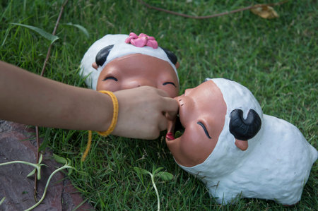 sheep ceramic doll garden grass two youngの写真素材
