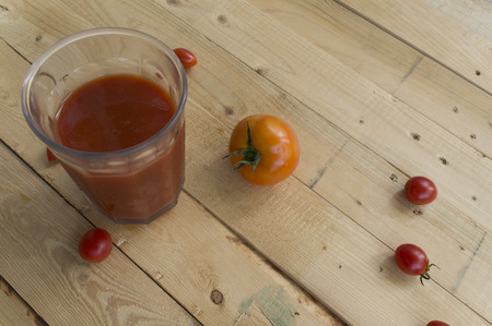fresh tomato juice on wooden tableの写真素材