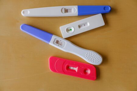 Many positive pregnancy tests on  the Tableの写真素材