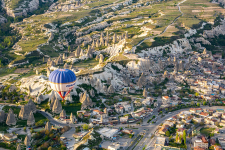 Hot Air Balloon Flying Over The Mountain in Cappadocia Turkeyのeditorial素材