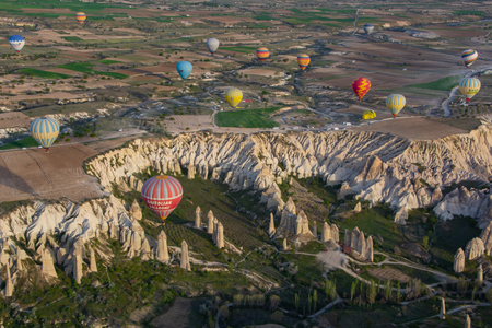Hot Air Balloon Flying Over The Mountain in Cappadocia Turkeyのeditorial素材