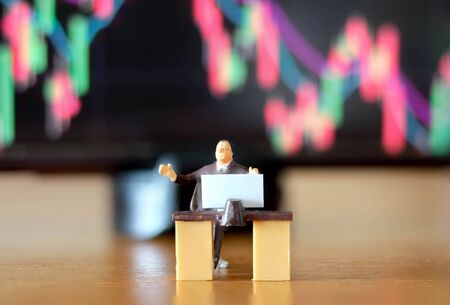 Miniature figure business people or Stock Trader meeting and consulting in front of Blur Price Stock...
