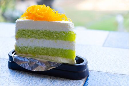 Pandan Cake with golden egg yolk thread on Top on The Tableの写真素材