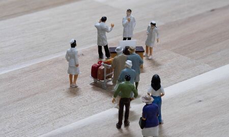 miniature passenger Waiting for queue ant the virus disease medical control checkpoint that have doctor and nurse standby for checkingの写真素材