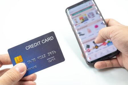 The photo of mobile phone open shopping app and credit card for shopping online conceptの写真素材