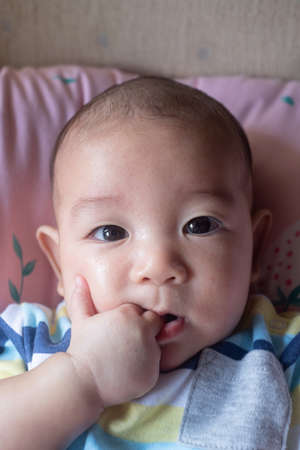 The Sleeping cute New Born Baby infant on the bedの写真素材