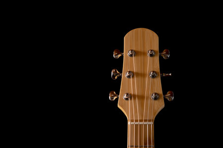 guitar headstock made from bamboo isolated on Black Backgroundの写真素材
