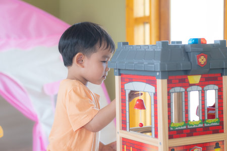Kid Asian baby boy smile have fun happy playing toys in playroom or playgroundの写真素材