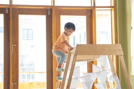 Kid Asian baby boy smile have fun happy playing toys in playroom or playgroundの写真素材