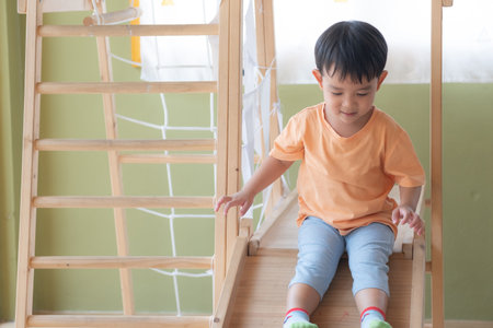 Kid Asian baby boy smile have fun happy playing toys in playroom or playgroundの写真素材